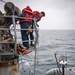 USS Higbee Sailors Conduct Maintenance on Davit