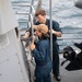 USS Higbee Sailors Conduct Maintenance on Davit