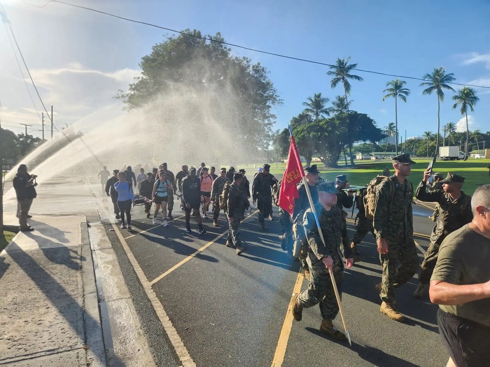 Fort Buchanan Remembers the 9/11 attacks with a road march and donating food to the island's disadvantaged