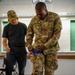 U.S. Marshal Instructs Guardsman on Tourniquet Application Techniques