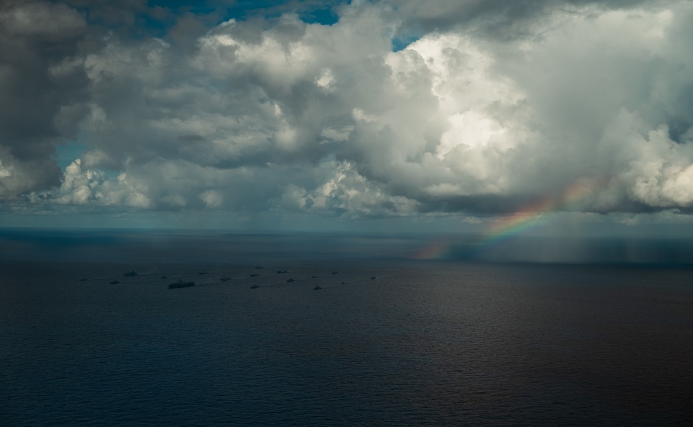 U.S., Allied, and Partner ships steam in formation