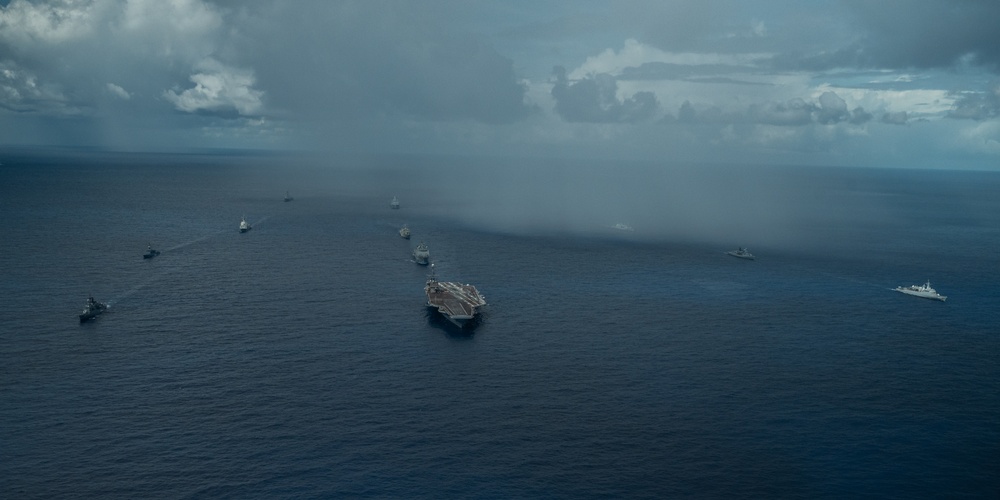 U.S., Allied, and Partner ships steam in formation