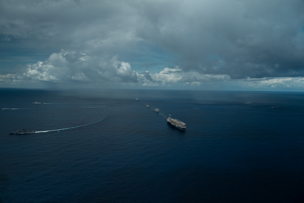 U.S., Allied, and Partner ships steam in formation