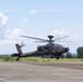 U.S. Marines, Sailors, Japan Ground Self-Defense Force members refuel AH-64 Apaches with MV-22B Ospreys