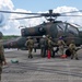 U.S. Marines, Sailors, Japanese Ground Self-Defense Force Members refuel AH-64 Apaches with MV-22B Ospreys