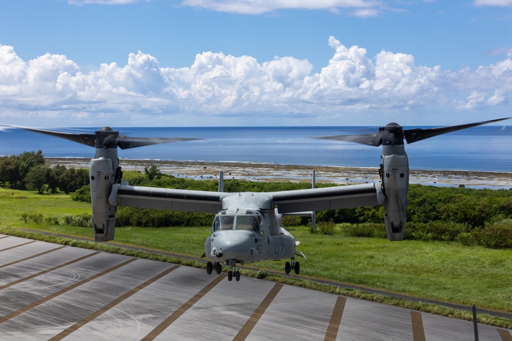 U.S. Marines, Sailors, Japan Ground Self-Defense Force members refuel AH-64 Apaches with MV-22B Ospreys