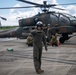 U.S. Marines, Sailors, Japan Ground Self-Defense Force members refuel AH-64 Apaches with MV-22B Ospreys