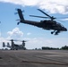 U.S. Marines, Sailors, Japan Ground Self-Defense Force members refuel AH-64 Apaches with MV-22B Ospreys