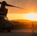 U.S. Marines, Sailors, Japan Ground Self-Defense Force members refuel AH-64 Apaches with MV-22B Ospreys