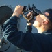 QMSA Jace Orourke takes a solar azimuth reading from the USS Bulkeley (DDG 84)