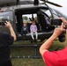Children pose in an Iowa National Guard UH-72 Lakota at Wall of Remembrance Ceremony
