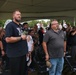 Attendees honor the flag during Pledge of Allegiance at Wall of Remembrance ceremony