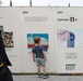 Young boy observes Global War on Terror history panels at Wall of Remembrance in Solon, Iowa