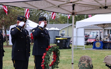 American Legion members place wreath and salute at Wall of Remembrance ceremony in Solon, Iowa