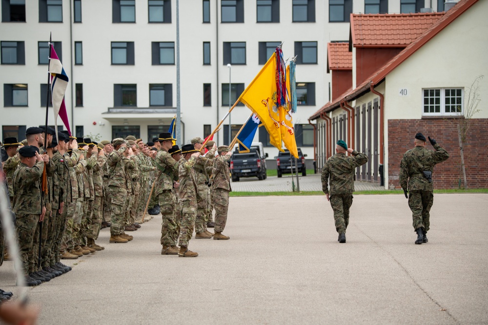 U.S. Soldiers render honors during Polish led troop inspection