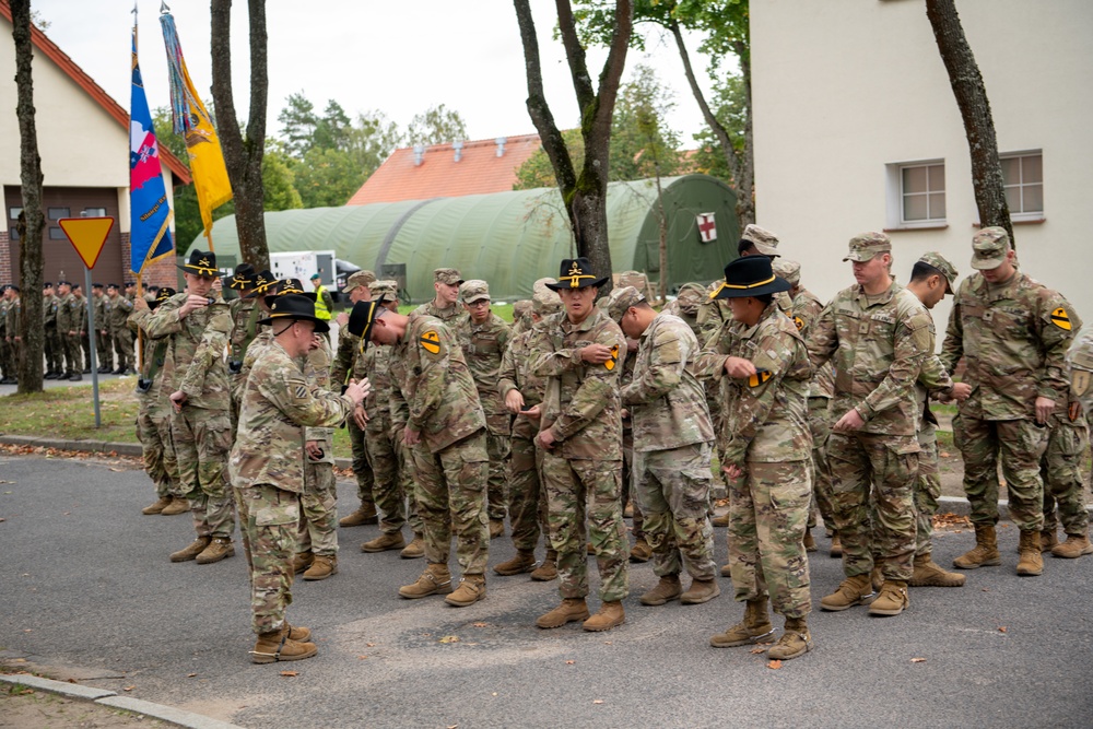 U.S. Soldiers don NATO battlegroup patches during transfer of authority