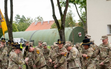 U.S. Soldiers don NATO battlegroup patches during transfer of authority