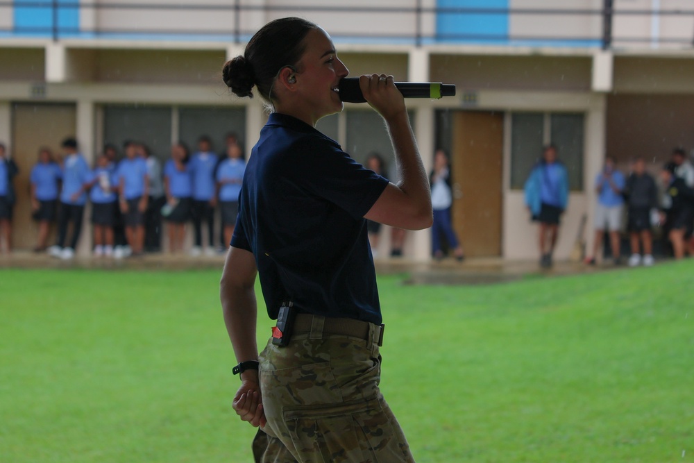 Pacific Partnership 2025 Multinational band member, Australian Army Private Miella Sartori, performs for Palau High School students, in support of Pacific Partnership 2025, Sept. 23.
