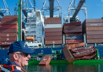 Rear Adm. Jeffrey Novak visits Coast Guard Station Los Angeles-Long Beach and the Incident Command Post for the Pier G container incident at the Port of Long Beach