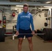 Sailors participate in Morale, Welfare and Recreation weight lifting competition.