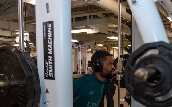 Sailors participate in Morale, Welfare and Recreation weight lifting competition.