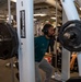Sailors participate in Morale, Welfare and Recreation weight lifting competition.
