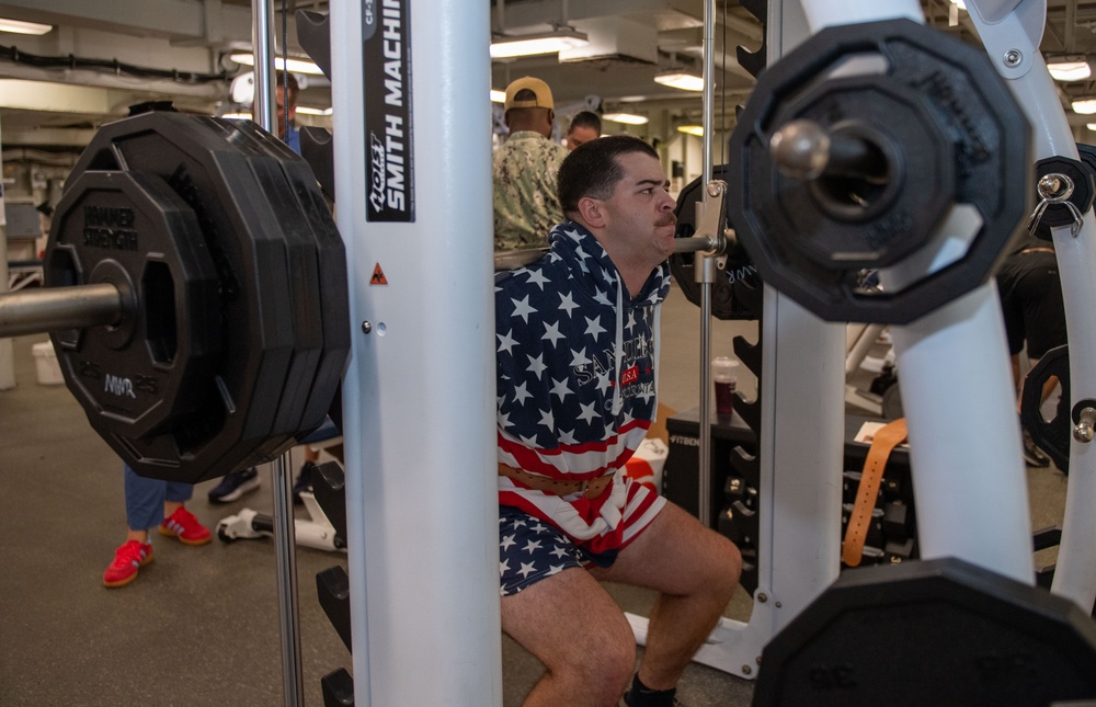 Sailors participate in Morale, Welfare and Recreation weight lifting competition.