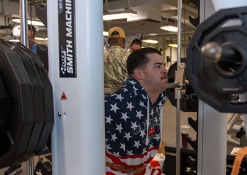 Sailors participate in Morale, Welfare and Recreation weight lifting competition.