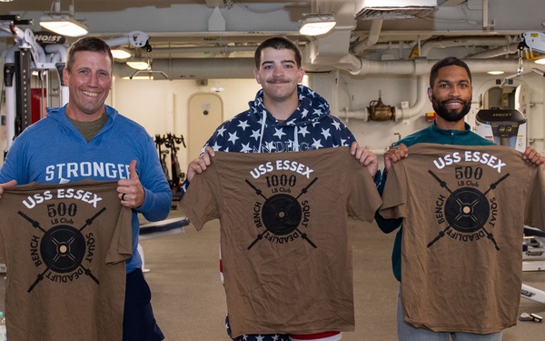 Sailors participate in Morale, Welfare and Recreation weight lifting competition.