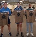 Sailors participate in Morale, Welfare and Recreation weight lifting competition.