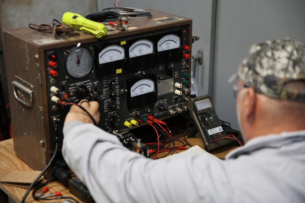 Radford Army Ammunition Plant employee checking energy levels in the powerhouse.