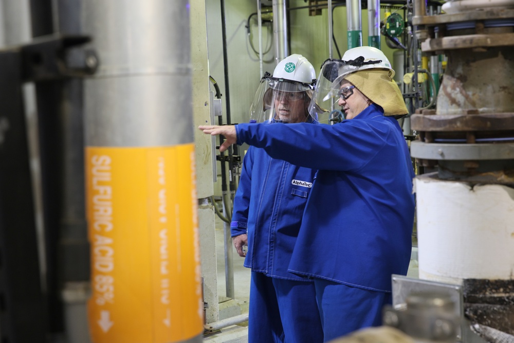 Close up of employees inspecting processes in the new Nitrocellulose Facility at Radford Army Ammunition Plant.