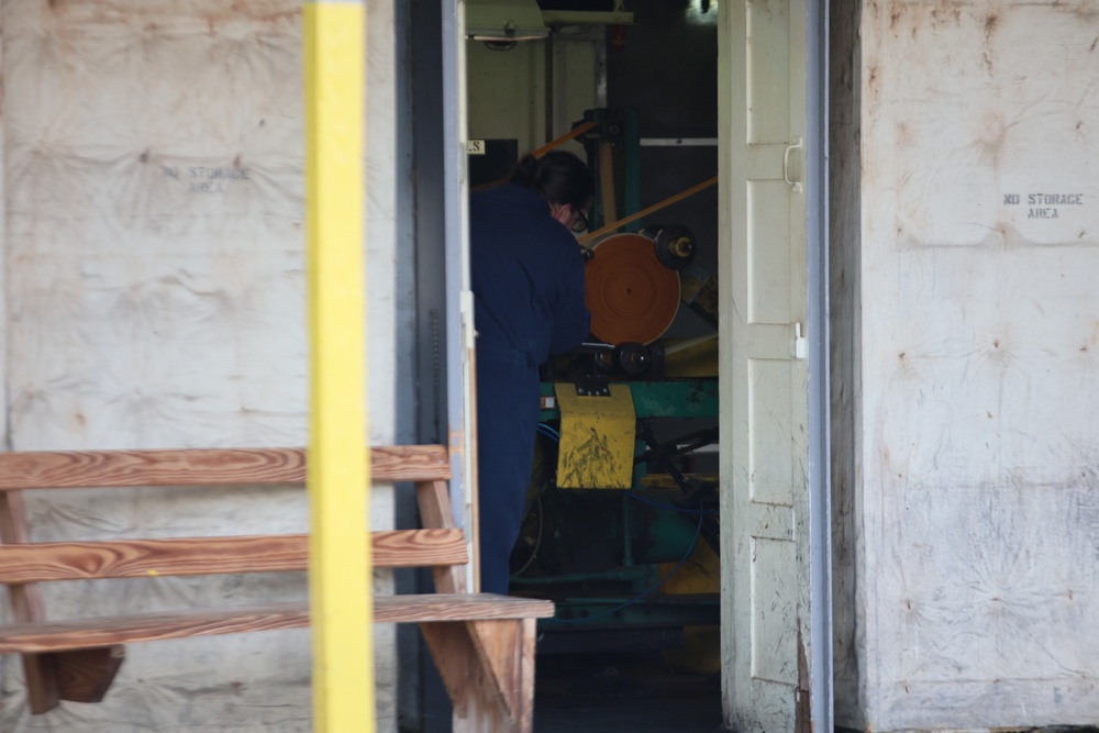 Employee on roll powder line at Radford Army Ammunition Plant.