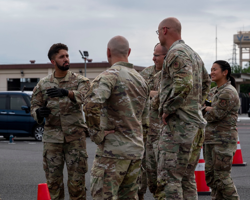 374 AW leadership attend 374 LRS vehicle rollover training