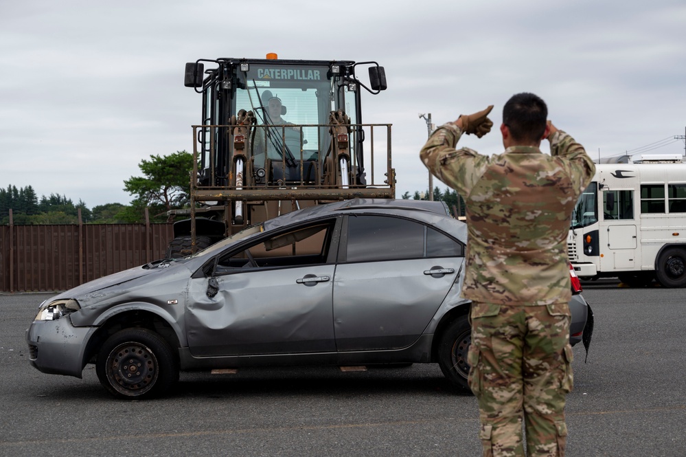 374 AW leadership attend 374 LRS vehicle rollover training