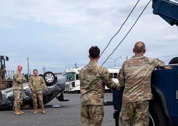 374 AW leadership attend 374 LRS vehicle rollover training