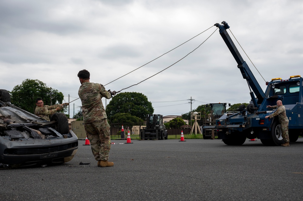 374 AW leadership attend 374 LRS vehicle rollover training