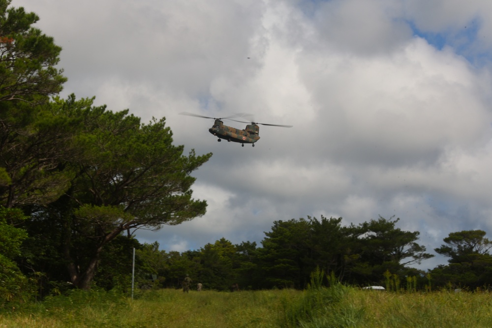 Marines with HMH-462, CLR-3, JGSDF members transport surface-to-surface missile on CH-53E Super Stallion