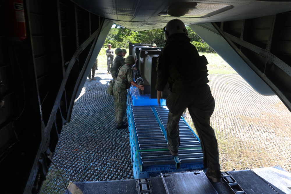 Marines with HMH-462, CLR-3, JGSDF members transport surface-to-surface missile on CH-53E Super Stallion