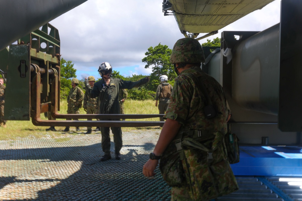 Marines with HMH-462, CLR-3, JGSDF members transport surface-to-surface missile on CH-53E Super Stallion