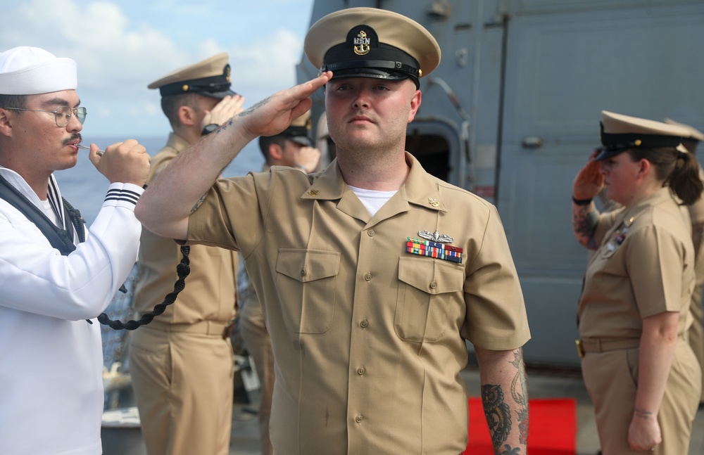 Sailors aboard the USS John Finn hold a chief petty officer pinning ceremony in the South China Sea