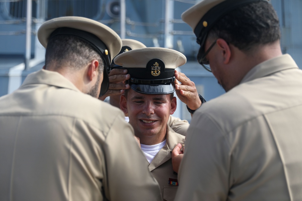 Sailors aboard the USS John Finn hold a chief petty officer pinning ceremony in the South China Sea