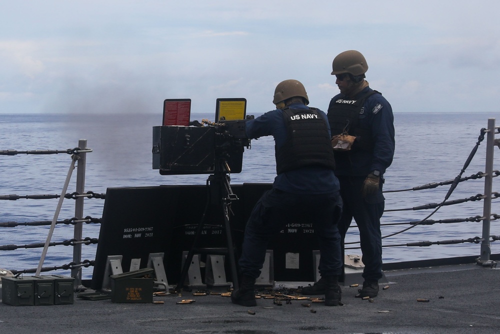 Sailors aboard the USS John Finn conduct a gun shoot in the South China Sea