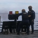 Sailors aboard the USS John Finn conduct a gun shoot in the South China Sea