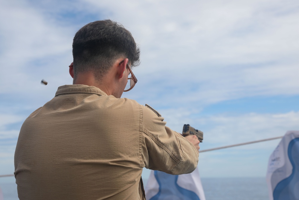 Sailors aboard the USS John Finn conduct a gun shoot in the South China Sea