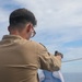 Sailors aboard the USS John Finn conduct a gun shoot in the South China Sea