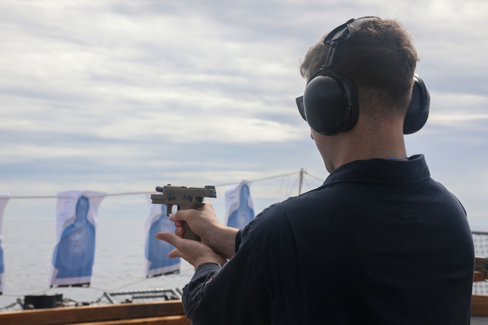 Sailors aboard the USS John Finn conduct a gun shoot in the South China Sea