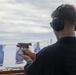 Sailors aboard the USS John Finn conduct a gun shoot in the South China Sea