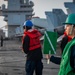 USS Gerald R. Ford (CVN 78) Sailor Signals During Replenishment-at-Sea