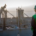 USS Gerald R. Ford (CVN 78) Sailor Signals During Replenishment-at-Sea